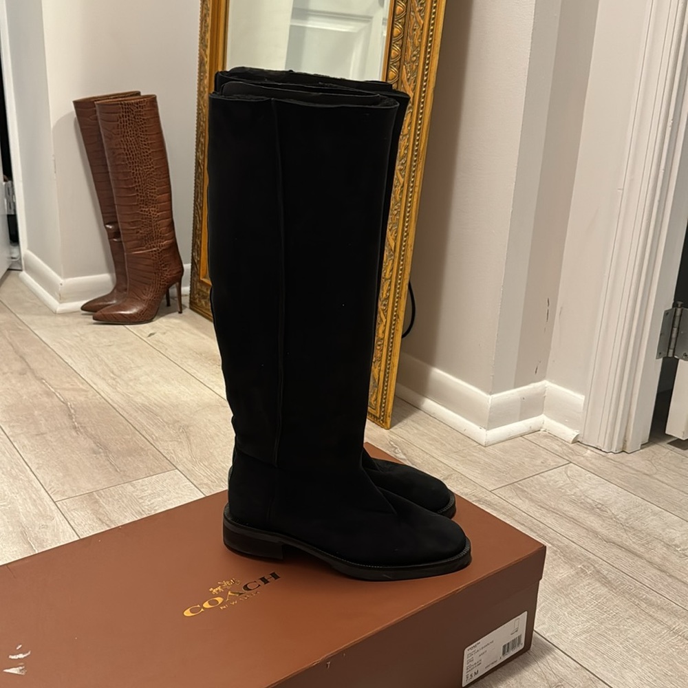 Coach black shearling boots! Only worn once. Complete box and mint condition